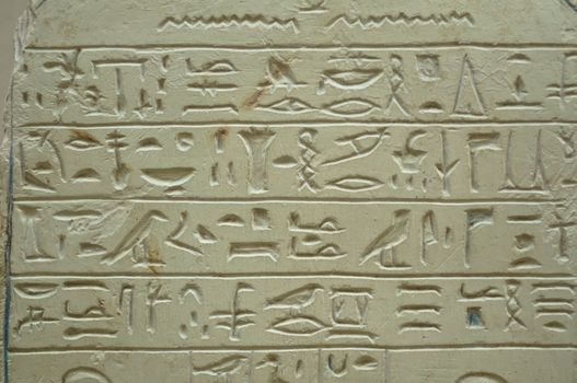 Ancient Egypt hieroglyph writing and sign on stone wall