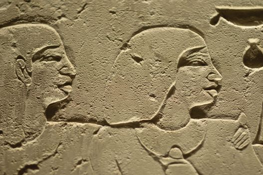 Ancient Egypt hieroglyph writing and sign on stone wall