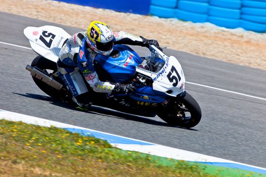 JEREZ DE LA FRONTERA, SPAIN - APR 17: Stock Extreme motorcyclist Ferran Casas takes a curve in the CEV Championship race on April 17, 2011 in Jerez de la Frontera, Spain