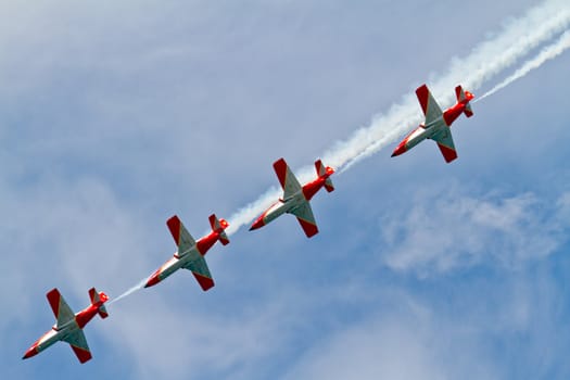 CADIZ, SPAIN-SEP 9: Aircrafts of the Patrulla Aguila taking part in a test on the 4th airshow of Cadiz on Sep 9, 2011, in Cadiz, Spain