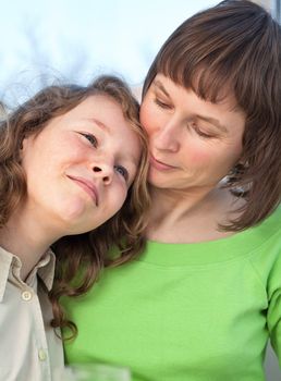 Loving mother and he daugther sitting together