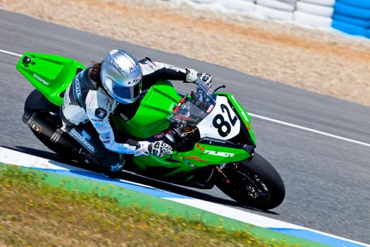 JEREZ DE LA FRONTERA, SPAIN - APR 17: Stock Extreme motorcyclist Elena Rosell takes a curve in the CEV Championship race on April 17, 2011 in Jerez de la Frontera, Spain