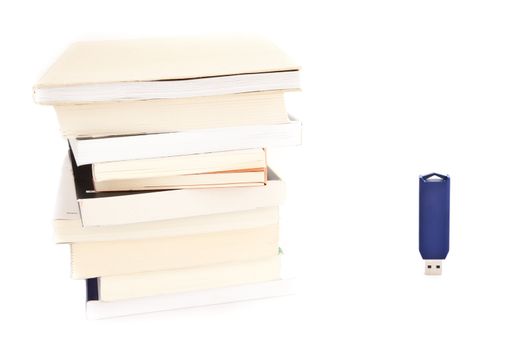 Concept of memories: blue usb key close to books