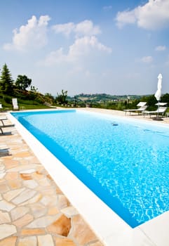 Swimming pool of an Italian beauty farm in the middle vineyards, Monferrato area, Piemonte region.