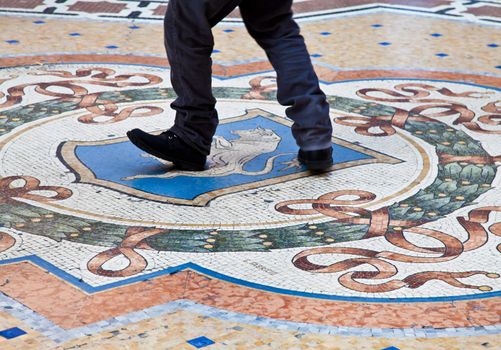 Italy, Milan. The Milanese tradition that is saying that if you turn quickly 3 times on your heel over the bull's testicles you attract good luck