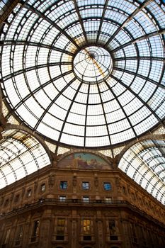 The Galleria Vittorio Emanuele II is a covered double arcade formed of two glass-vaulted arcades at right angles intersecting in an octagon, prominently sited on the northern side of the Piazza del Duomo in Milan.