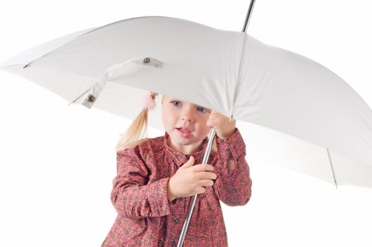 Shot of little girl with umbrella in studio