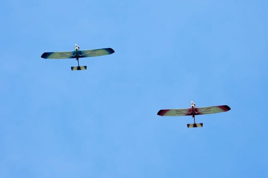 This image shows two microlight airplanes in fly