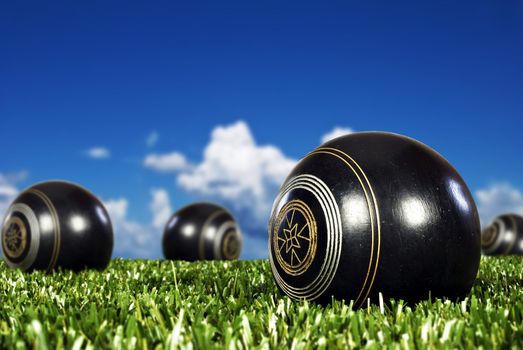 Close up of bowling balls on an open bowling field