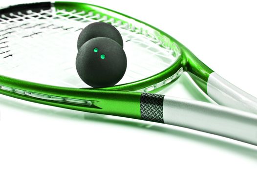 Green squash racket with balls on white background with space for text