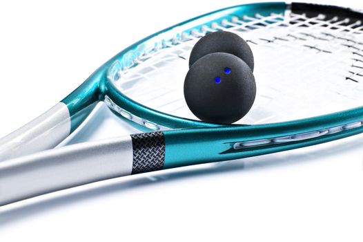Blue squash racket with balls on white background