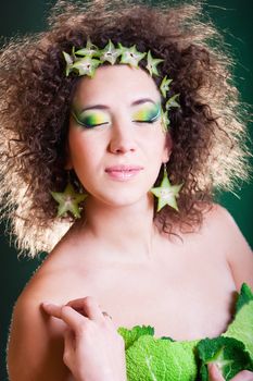 beautiful pregnant young woman dressed in cabbage