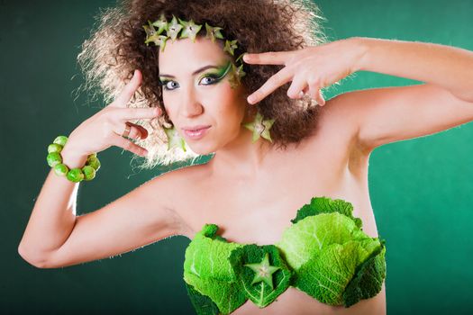 beautiful pregnant young woman dressed in cabbage