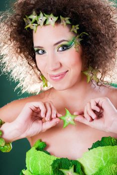 beautiful pregnant young woman dressed in cabbage