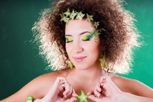 beautiful pregnant young woman dressed in cabbage