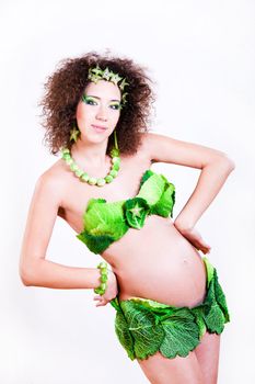 beautiful pregnant young woman dressed in cabbage