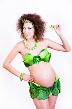 beautiful pregnant young woman dressed in cabbage