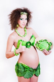 beautiful pregnant young woman dressed in cabbage