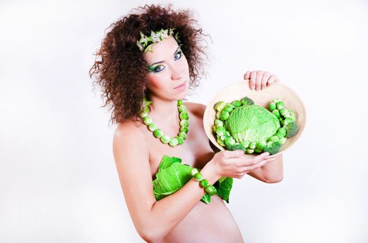 beautiful pregnant young woman dressed in cabbage