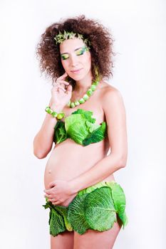 beautiful pregnant young woman dressed in cabbage