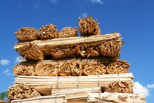 Close-up of a woodstack against a very blue sky