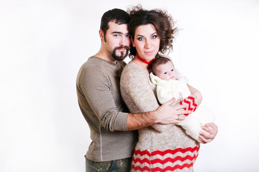 pregnant woman with her ​​husband and child isolated on white background