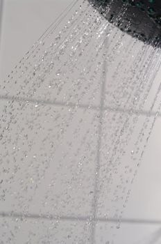 water drops falling from a shower indoors