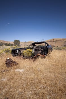 An old rusty abandoned car.