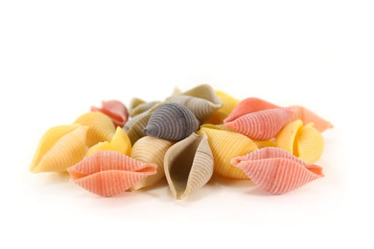 colorful raw pasta on a white background
