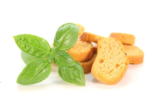 a handful Bruschetta with basil on a white background