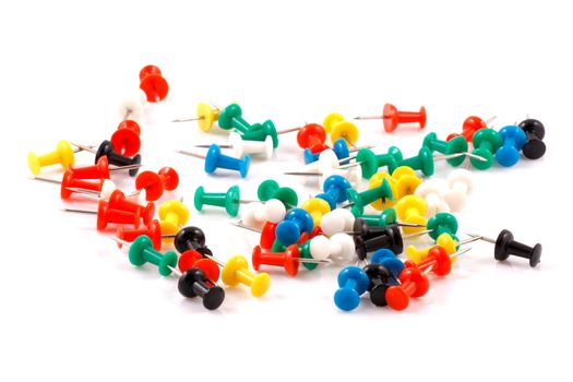 Collection of various pushpins on white background