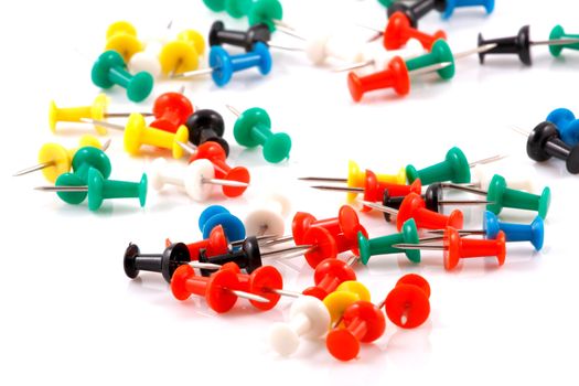 Collection of various pushpins on white background