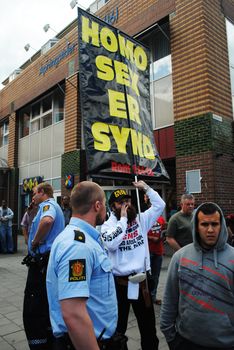 A anti-gay religious fanatic beeing handled by police during the gay pride parade in Oslo 25.06.2011.