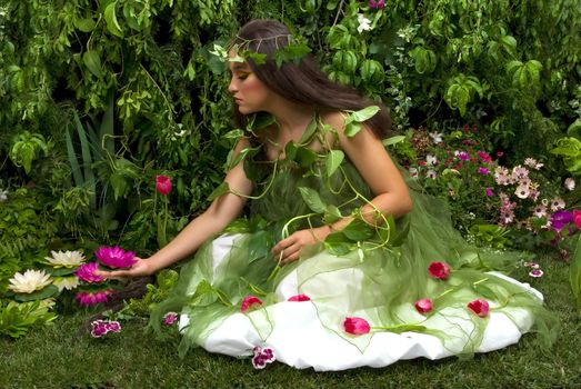 Mother Nature looking upon some of her many beautiful creations in her enchanted garden.
This indoor studio shoot is a compilation of many fresh flowers, grass, tree branches and bushes. 

