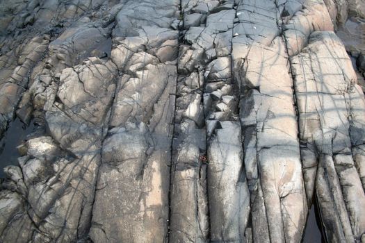 cracked cloudy gray rock
