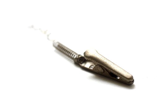 Close up shot of a metal alligator clip