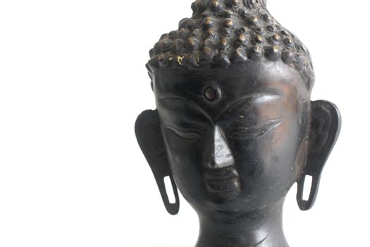 Isolated shot of Buddha's bust on white