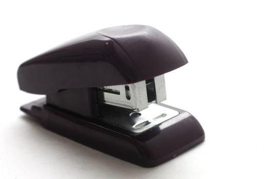 isolated shot of a small black stapler on white