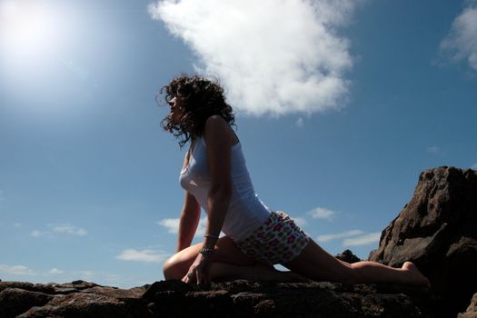 a beautiful woman doing yoga to show a healthy way to live a happy and relaxed lifestyle in a world full of stress