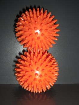 two massage balls on each other symbolizing balance and interaction