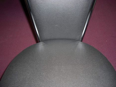 Black chair on a purple floor