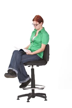 Girl with green blouse reading a book.