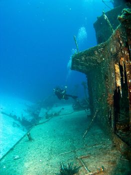 Underwater Photographer Shooting a Sunken Ship in Cayman Brac