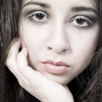 Studio portrait of an asian mixed raced teenager looking bored