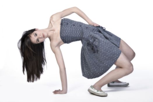 Studio portrait of a beautiful mixed race, vietnamese girl stretching