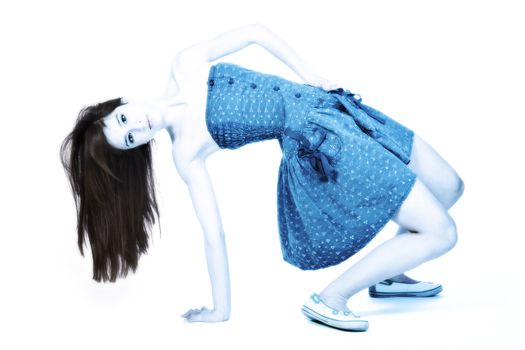 Studio portrait of a beautiful mixed race, vietnamese girl stretching in a cross process