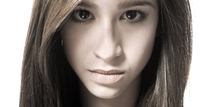 Studio portrait of a beautiful mixed race, vietnamese girl with hypnotic eyes