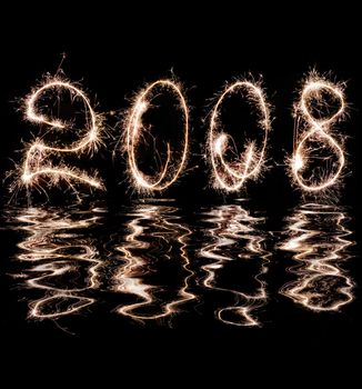 Inscription - 2008 made by celebratory fireworks and reflection in water