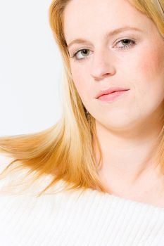 Studio portrait of young girl with reddish hair
