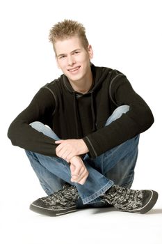 studio portrait of a young man smiling
